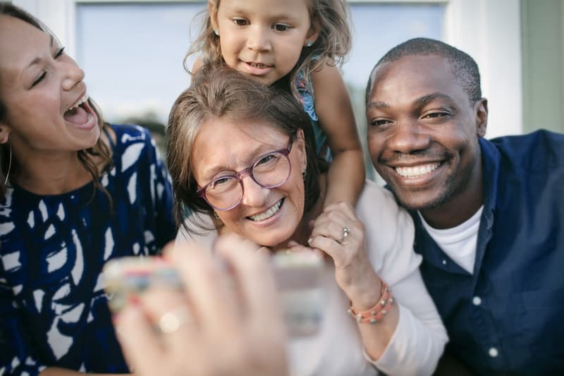 Elderly Woman Wearing Glasses with Family