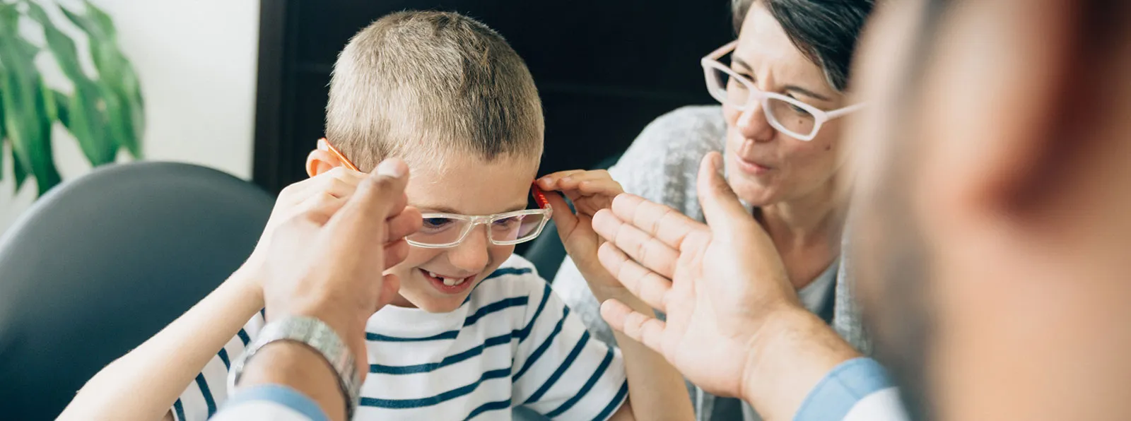 Child trying on glasses