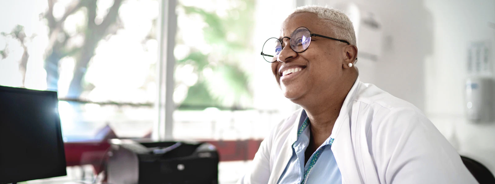 Woman smiling at her computer